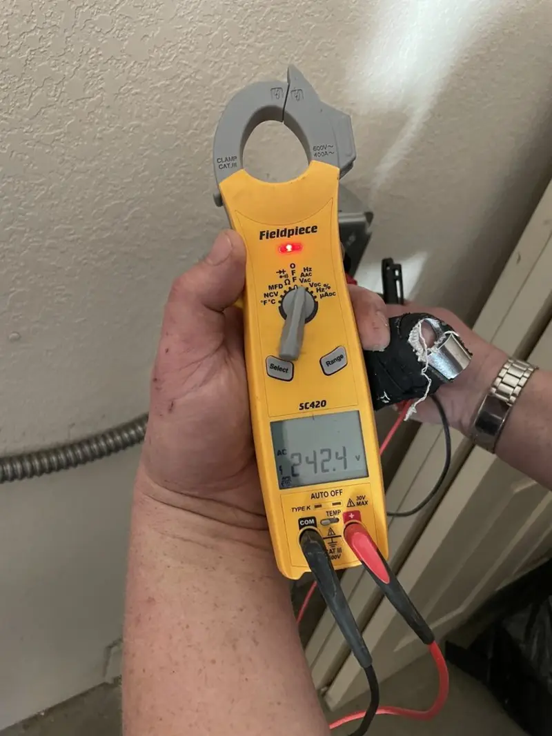 Voltage testing with clamp meter during Whole House Surge Protector in Alpharetta
